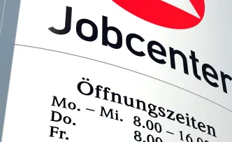 Schild mit Aufschrift "Jobcenter"
